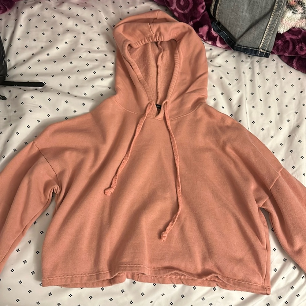 Medium, pink hoodie, brand ambiance
